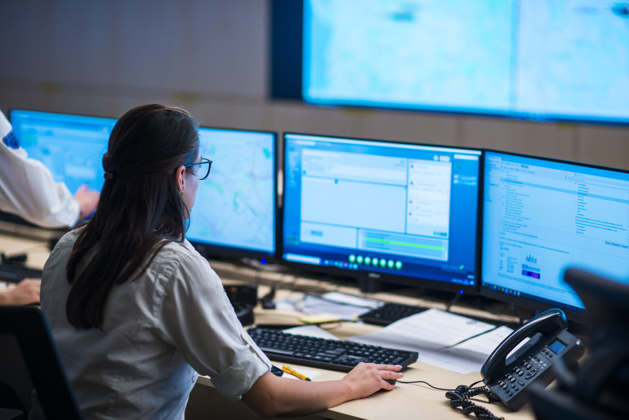 Female software engineer working in a modern monitoring office
